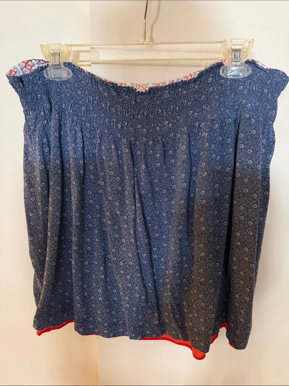 CAbi réversible mini skirt with Navy Blue, white flowers and reverse to red Trim
